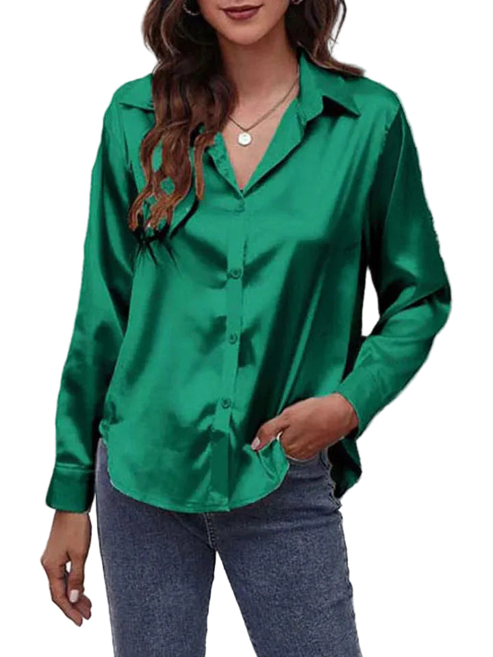 Elegant damblus med långa ärmar, klassisk design och knappslå, perfekt för vardag och fest