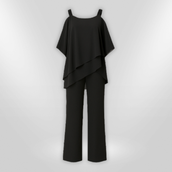 "Elegant damset med svart asymmetrisk topp och vida byxor som kombinerar stil och komfort för sofistikerade tillfällen."