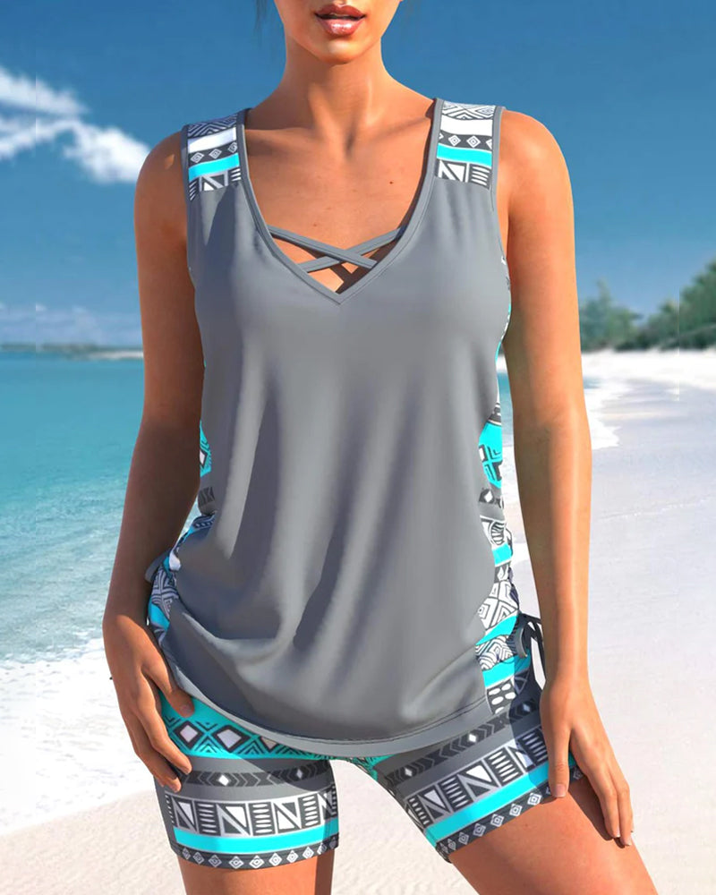 "Elegant damtankini med v-hals och kryssband, löst passform, snabbtorkande och med blommönster, perfekt för strand."