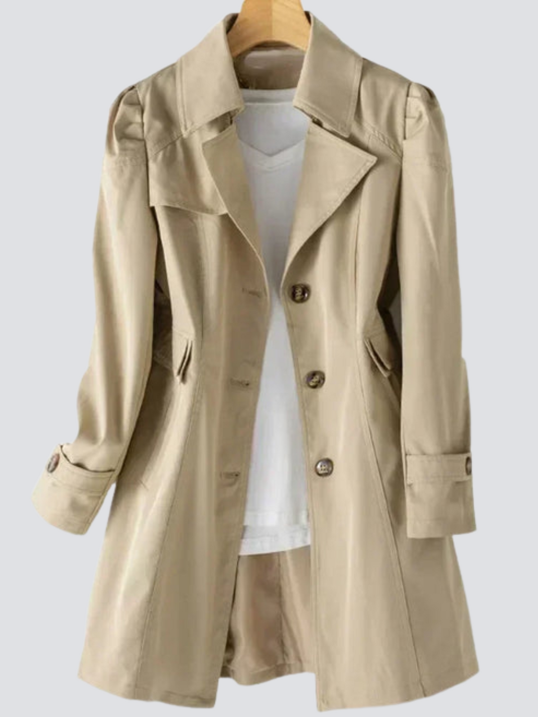 "Elegant damtrenchcoat i midi-längd med knappar, perfekt för höst/vinter. Visad i svart, långärmad, casual stil."