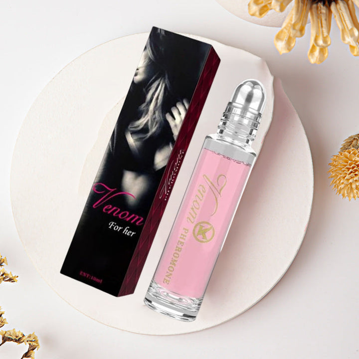 "Elegant flaska med rosa/guld toner, 10ml feromonparfym för män och kvinnor, förstärker naturlig attraktion."