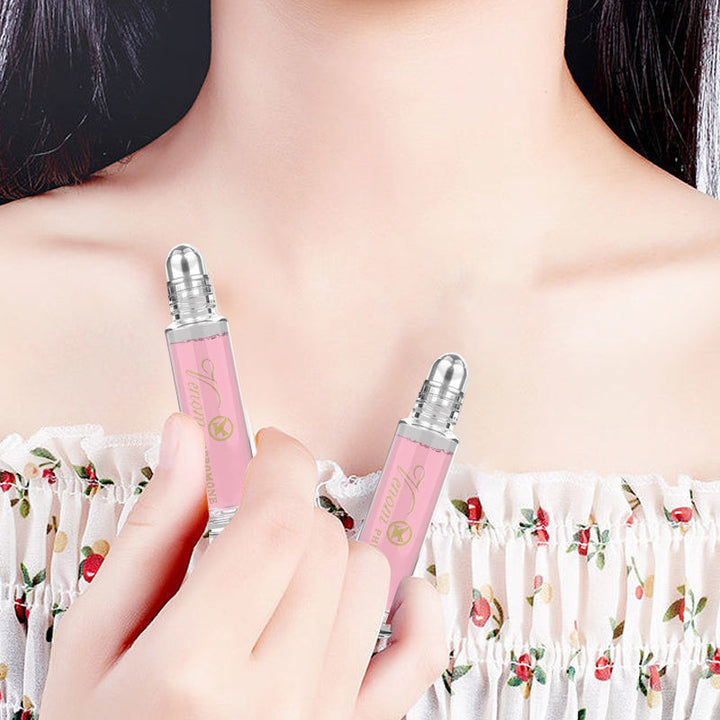 "Elegant flaska med rosa/guld toner, 10ml feromonparfym för män och kvinnor, förstärker naturlig attraktion."