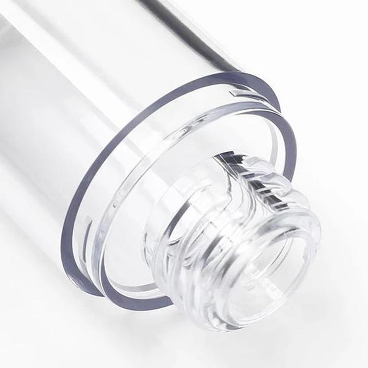 "Elegant genomskinlig pumpflaska för resor, hållbar plast, luftlös design, idealisk för skönhetsprodukter och essenser."