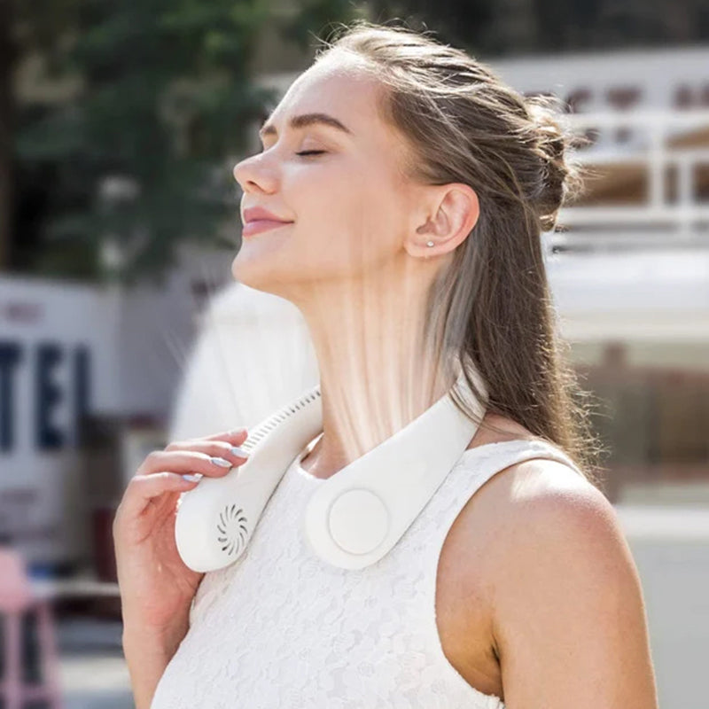 "Elegant, handsfri bärbar nackfläkt, tyst design, ger svalkande bris. Perfekt för sommarbruk, lätt och stilren."