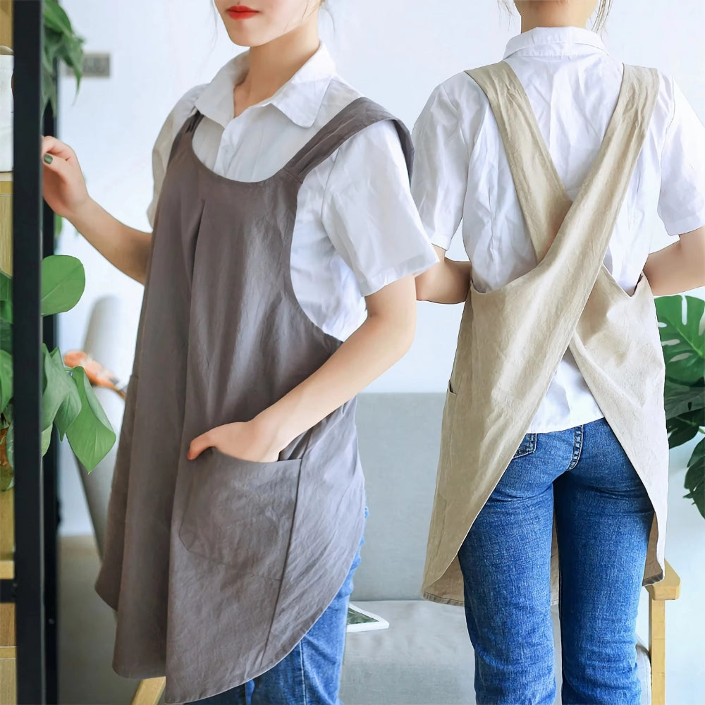 "Elegant koreanskt förkläde med korsrygg, mjuk textur, vida fickor. Perfekt för kök och vardagsbruk."