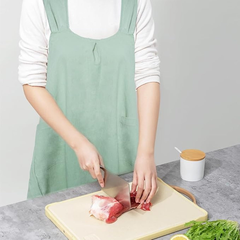 "Elegant koreanskt förkläde med korsrygg, mjuk textur, vida fickor. Perfekt för kök och vardagsbruk."