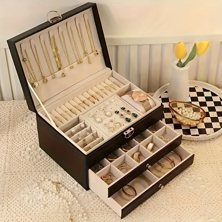 "Elegant läder smyckesbox med flera fack, perfekt för att organisera halsband, armband och ringar."