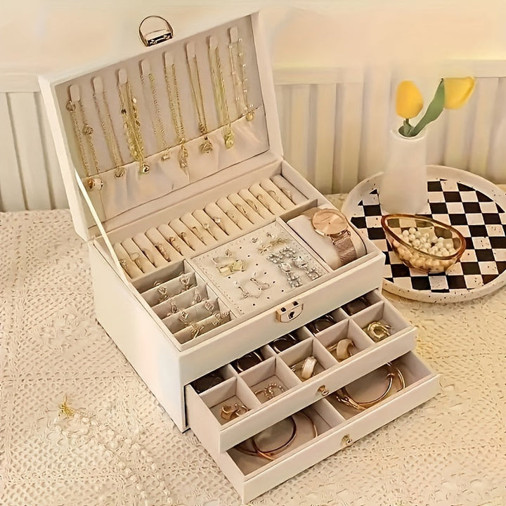 "Elegant läder smyckesbox med flera fack, perfekt för att organisera halsband, armband och ringar."