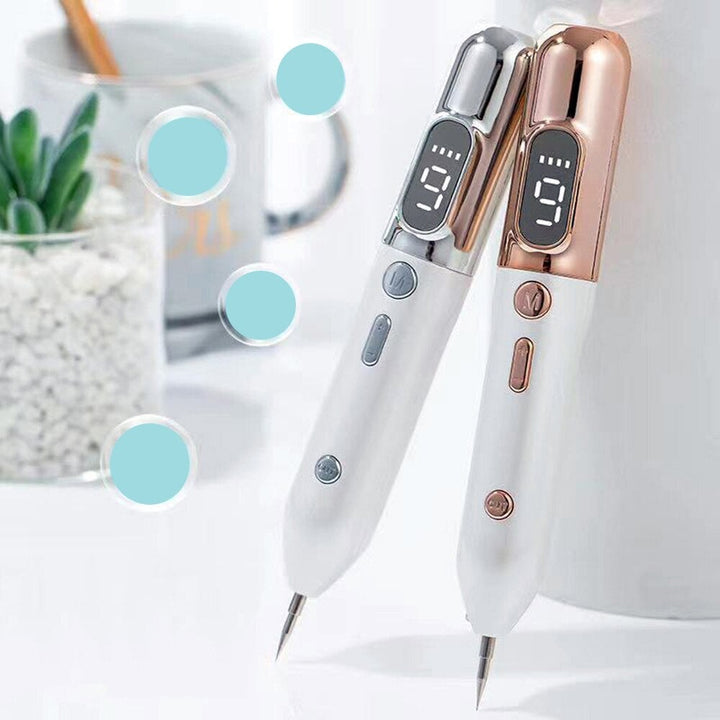 "Elegant Laser Plasma Pen i guld/silver för effektiv borttagning av hudfläckar och naturlig föryngring hemma."