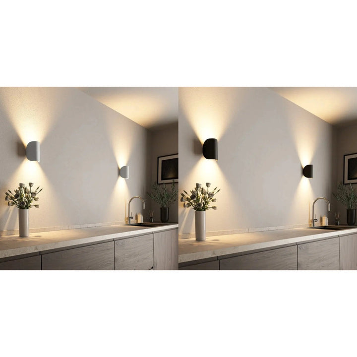 "Elegant LED vägglampa med modern stil, energieffektivt ljus, svart och vit design för alla rum."