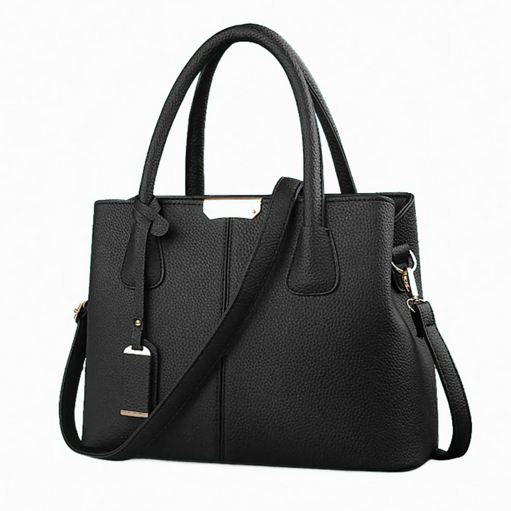"Elegant lila crossbody väska i konstläder med justerbar rem, perfekt för stilfull daglig användning och komfort."