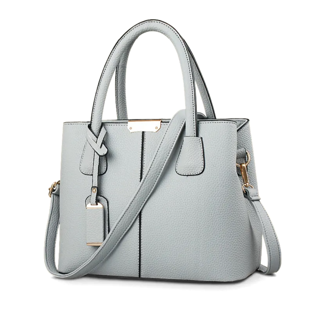 "Elegant lila crossbody väska i konstläder med justerbar rem, perfekt för stilfull daglig användning och komfort."