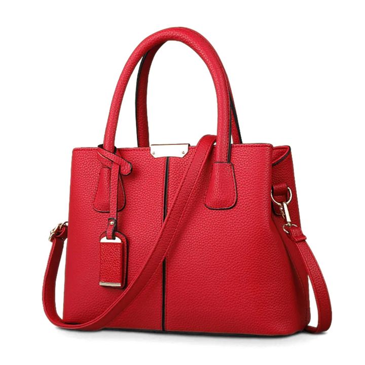"Elegant lila crossbody väska i konstläder med justerbar rem, perfekt för stilfull daglig användning och komfort."