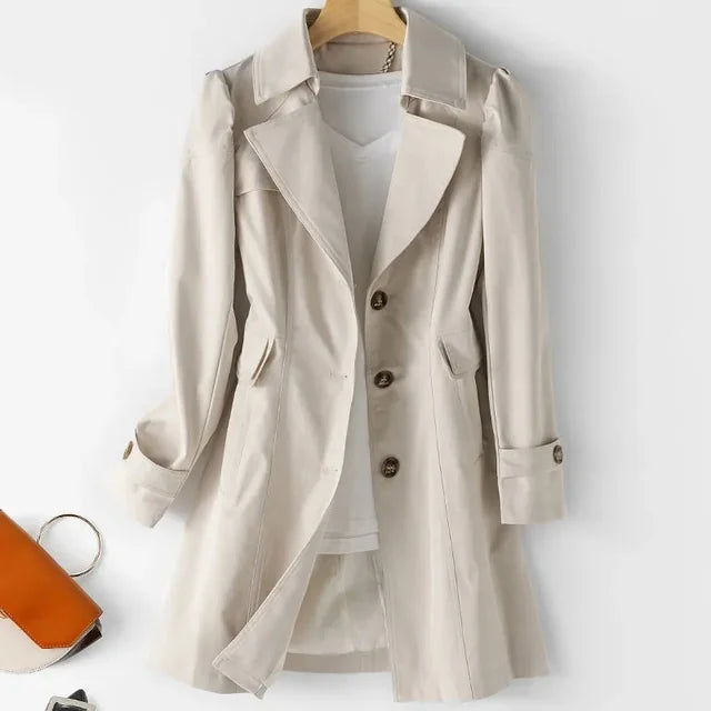 "Elegant mellanlång trenchcoat för damer med stilren design och bekväm passform, perfekt för vardagsbruk"