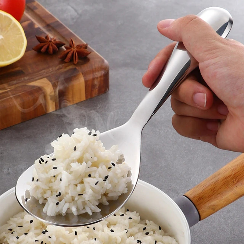 "Elegant och förtjockad non-stick rissked i rostfritt stål med ergonomiskt grepp, perfekt för kök och servering."