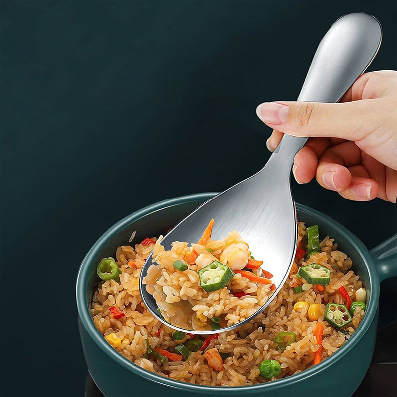 "Elegant och förtjockad non-stick rissked i rostfritt stål med ergonomiskt grepp, perfekt för kök och servering."