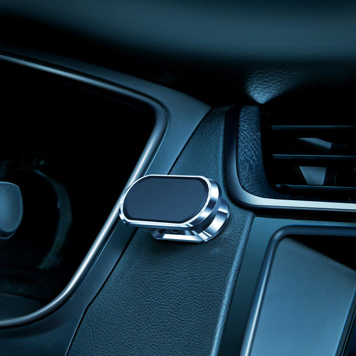 "Elegant och minimalistisk ultramagnetisk mobilhållare, svart finish, flexibel montering i bil eller hem för smartphones."