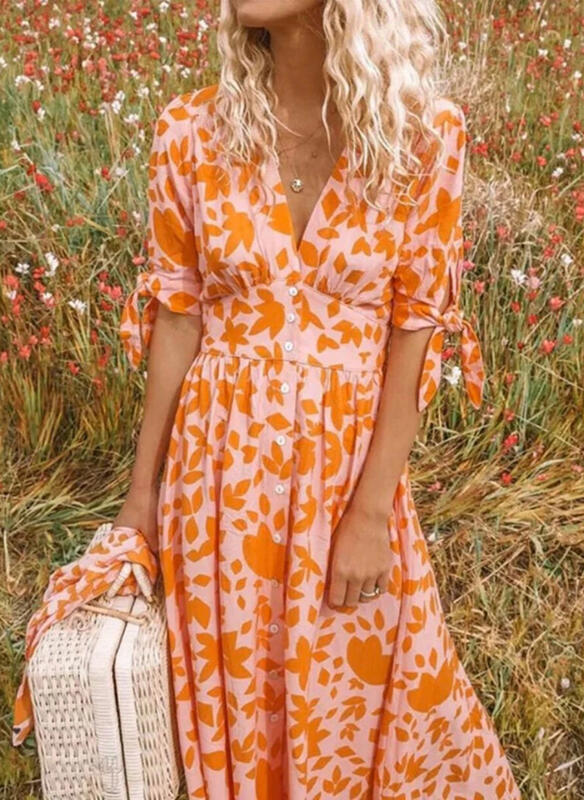 "Elegant orange sommarklänning för kvinnor, förtrollande design, perfekt för sommarbröllop och formella tillfällen."
