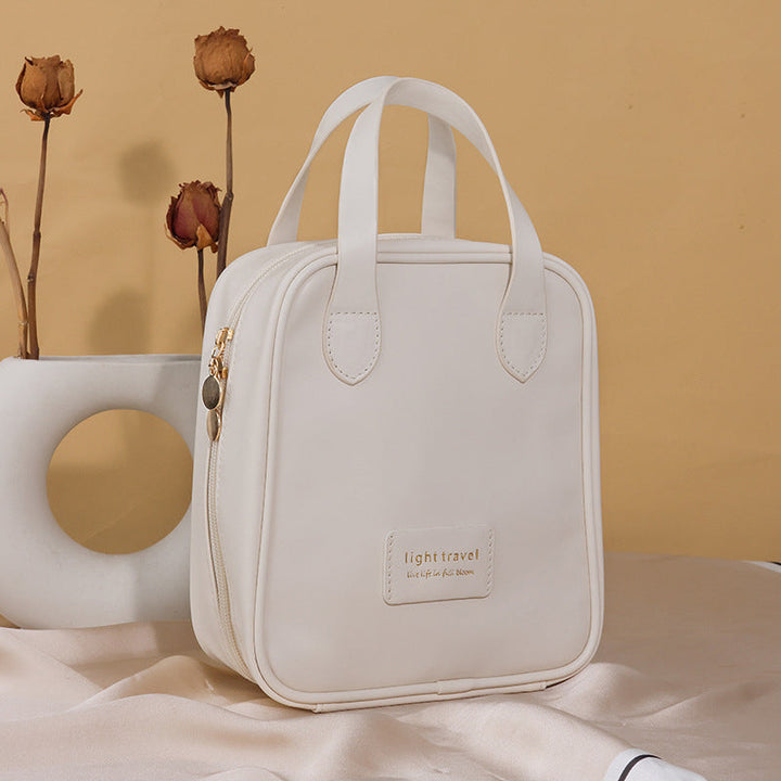 "Elegant PU-läder kosmetisk resväska för damer med många fack och robust handtag, perfekt för organisering och resor."