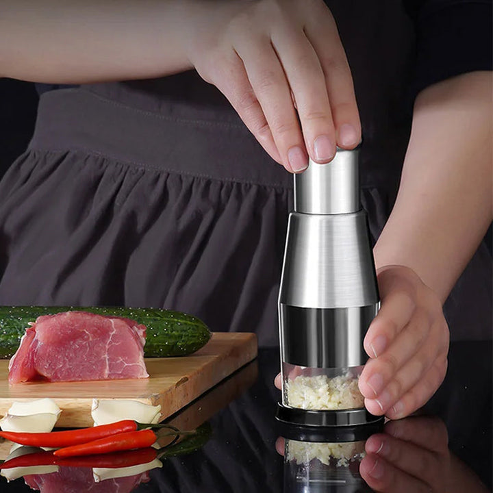 "Elegant rostfri vitlökshackare, perfekt för snabb och enkel matlagning i köket. Slät finish, hållbar design."