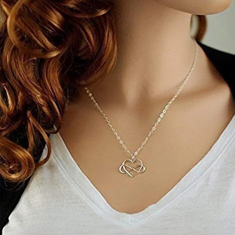 "Elegant silver oändlighetshjärta halsband för kvinnor med österrikiska zirkoner, dubbel infinity design, stilfullt smycke."