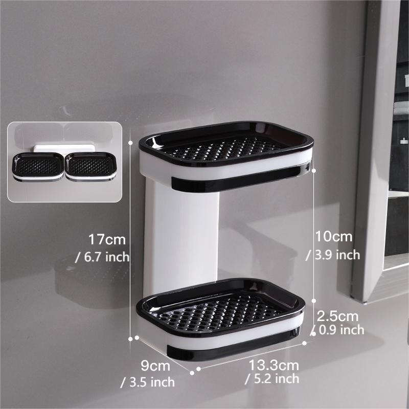 "Elegant svart och grå tvålkopp med avtappningsbricka, stilren design, glansig bakgrund, perfekt för badrumshylla."