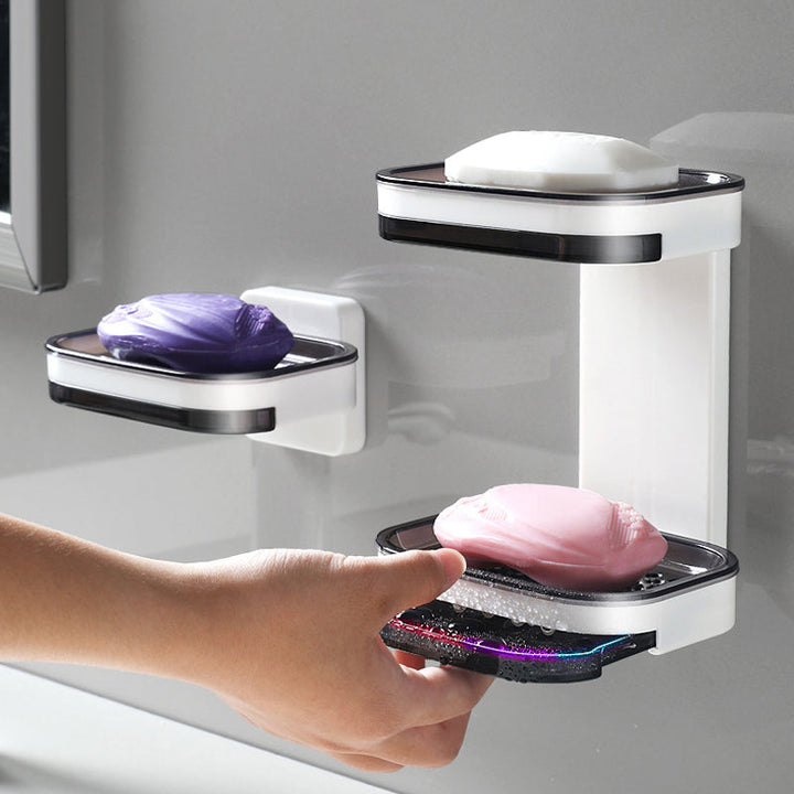 "Elegant svart och grå tvålkopp med avtappningsbricka, stilren design, glansig bakgrund, perfekt för badrumshylla."