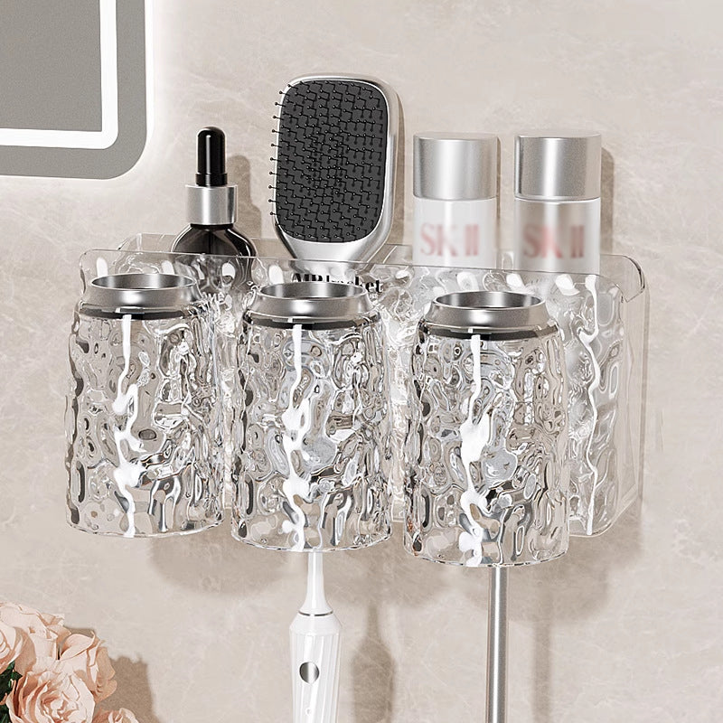 "Elegant väggmonterad tandborsthållare med munsköljkopp i silver/grå, sparar plats och håller badrummet organiserat."