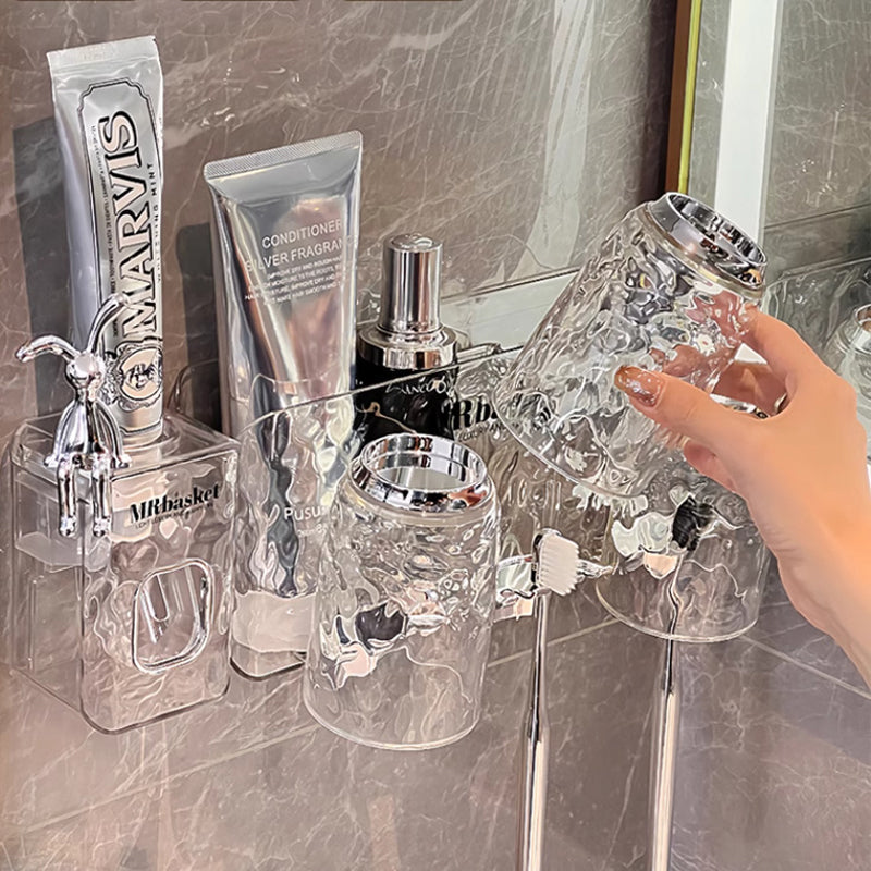 "Elegant väggmonterad tandborsthållare med munsköljkopp i silver/grå, sparar plats och håller badrummet organiserat."