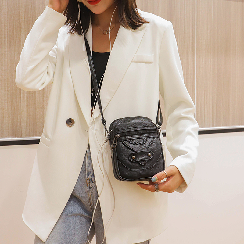 "Elegant vintage mini crossbody-väska i PU-läder, svart och kompakt, perfekt för kvinnor som söker stil och funktion."