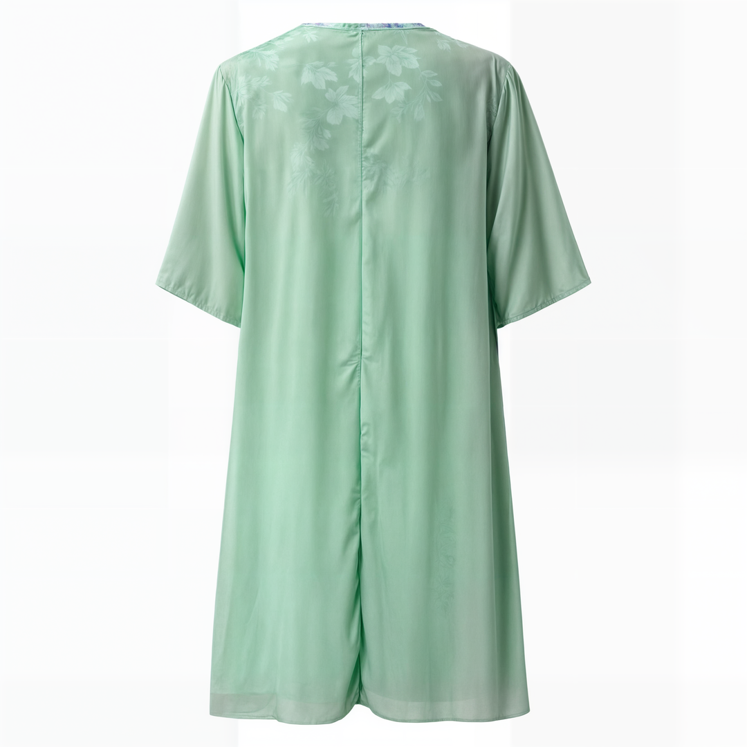 "Eleganta blommig klänning, vintage stil, A-line siluett, feminin design, perfekt för vårfest eller solig dag ute."