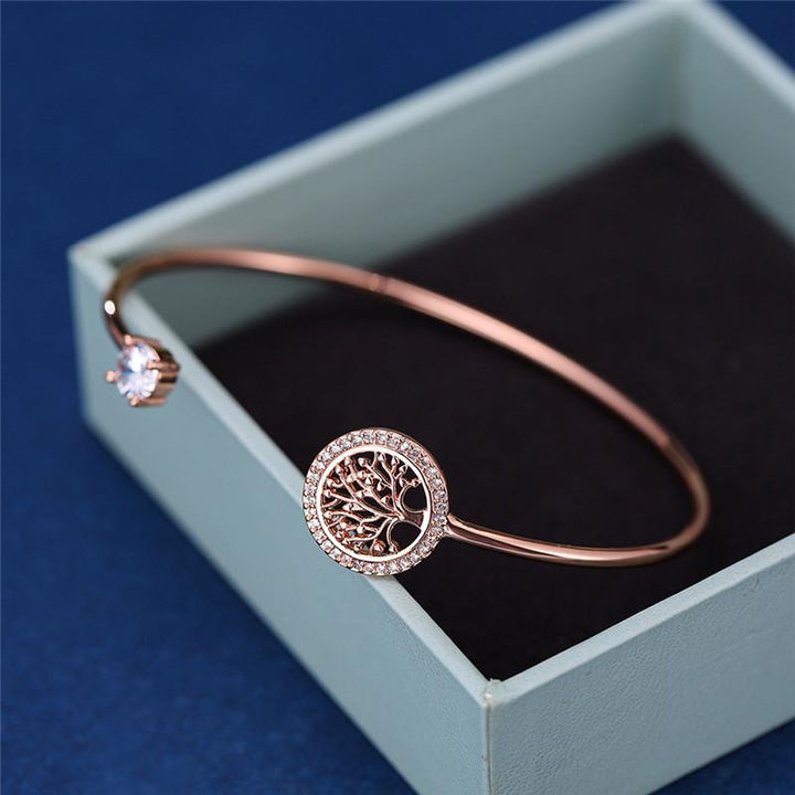 "Eleganta zirkonarmband för kvinnor i gyllen, roséguld, vitt guld, symboliserar livets värme och eviga stil."