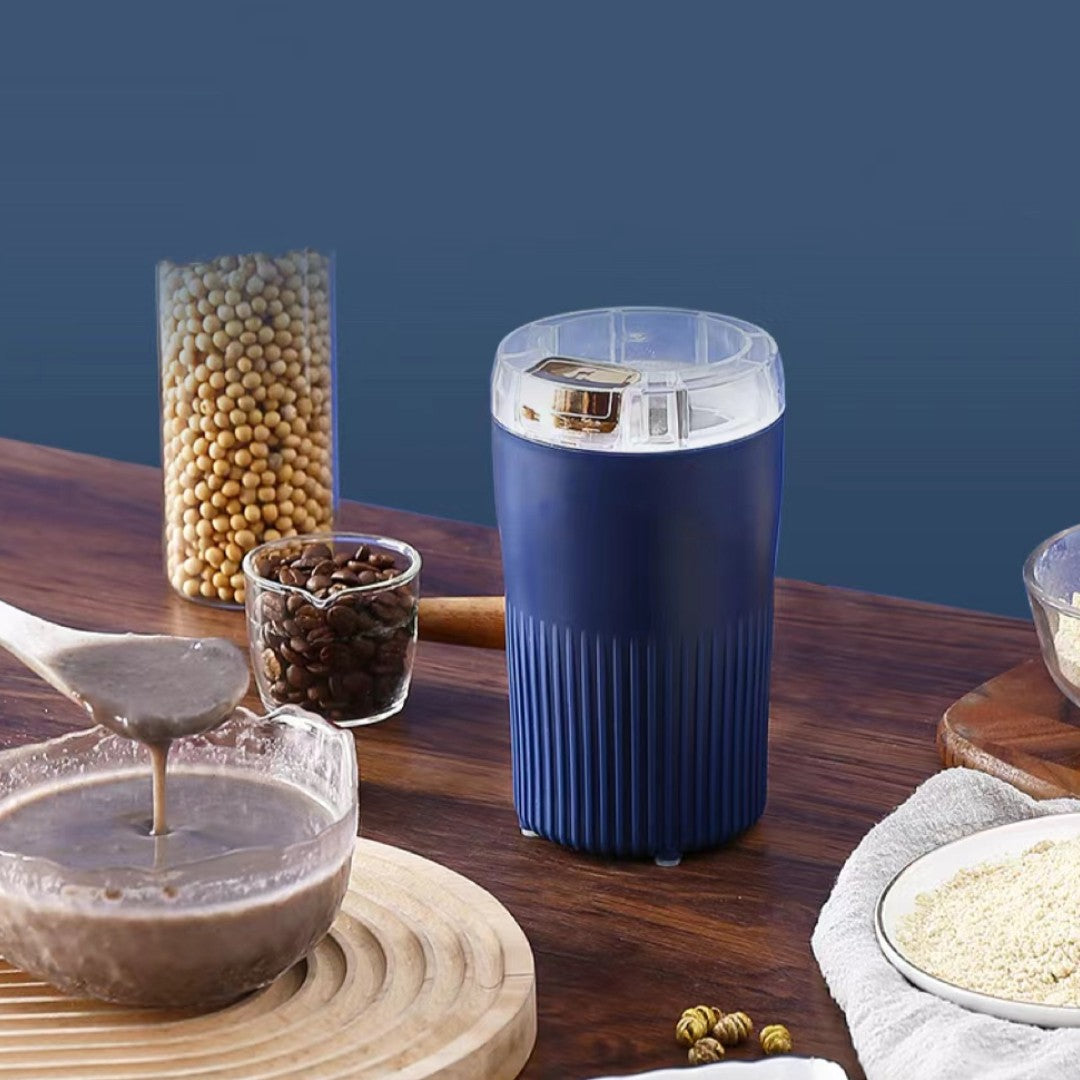 "Elektrisk kaffe- och kryddkvarn med kompakt design, kraftfull motor och moderna stålblad för effektiv malning i köket."