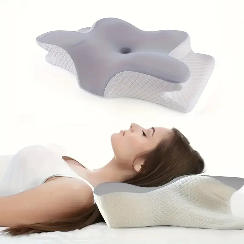 Ergonomisk kudde med handutrymmen för bättre sömn och kroppsstöd, vit med mjukt material och unik design.
