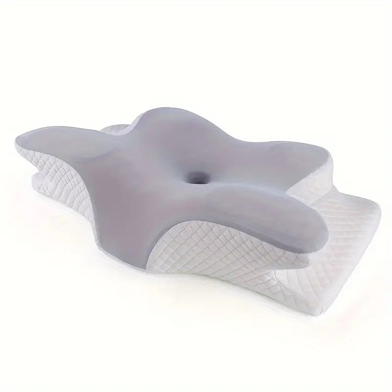 Ergonomisk kudde med handutrymmen för bättre sömn och kroppsstöd, vit med mjukt material och unik design.