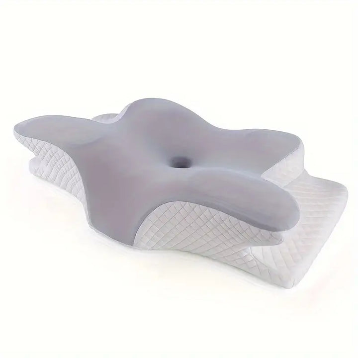 Ergonomisk kudde med handutrymmen för bättre sömn och kroppsstöd, vit med mjukt material och unik design.