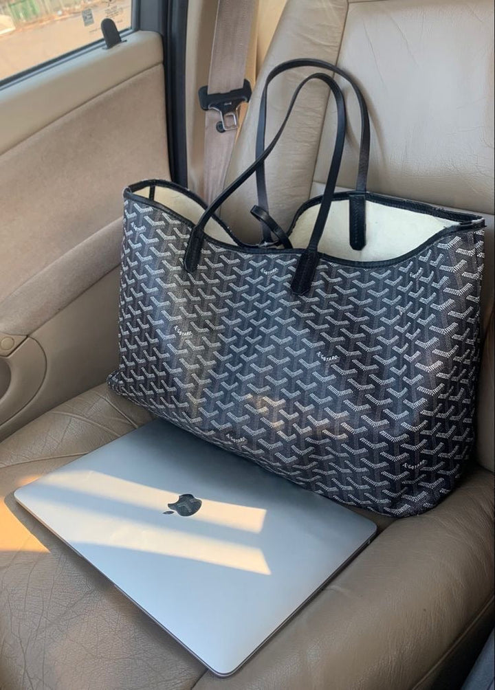 "Exklusiv shopperväska med tidlös design, minimalistiska linjer och rymligt inre, perfekt för vardag och fest."