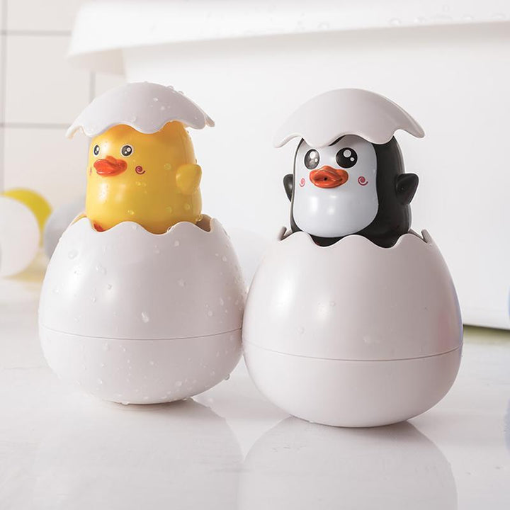 "Färgglatt dinosaurie- och ankägg badleksak för barn, perfekt för vattenlek, med gul, rosa, grön och blå färgkombination."