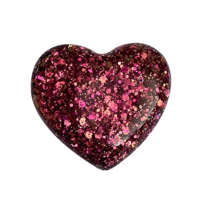 "Färgglatt hjärta i harts, fickvänlig accessoar med kärleksfullt budskap i olika nyanser: guld, blå, lila, grön."