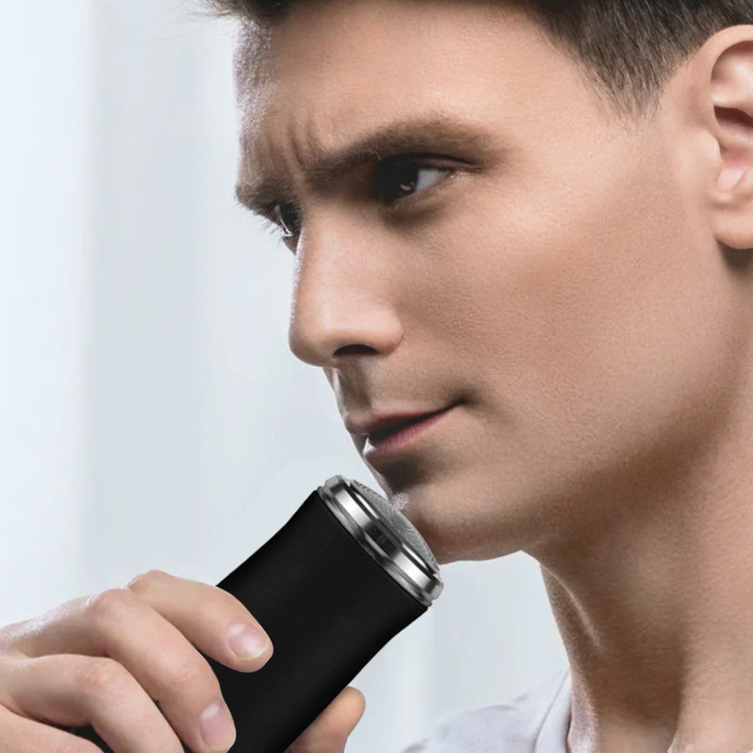 "Fickstorlek tvättbar elektrisk rakhyvel, grön eller svart, kompakt design, perfekt för resor, vattentät och snabbladdning."