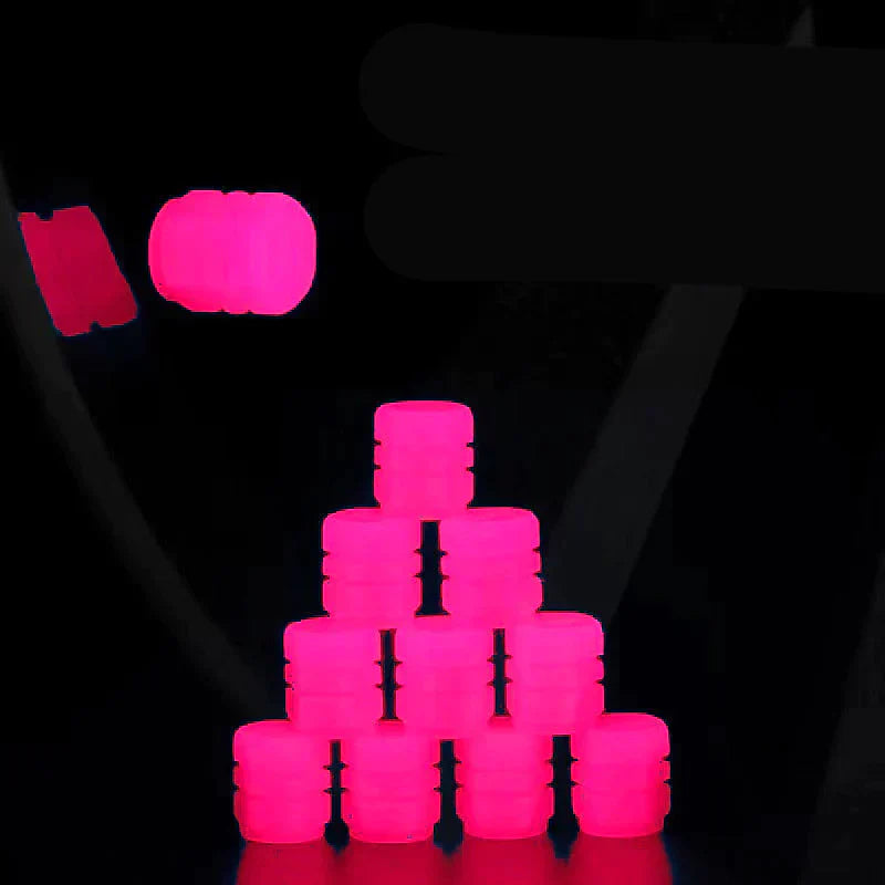 Fluorescerande ventilkåpor för bil och cykel på mörk bakgrund, ger gnistrande stil och skyddar mot smuts och damm.