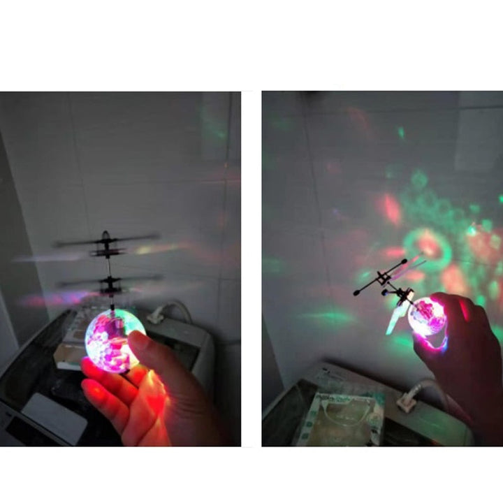 En barndrönare/helikopterboll i luften, fångad i rörelse, skarp bild.