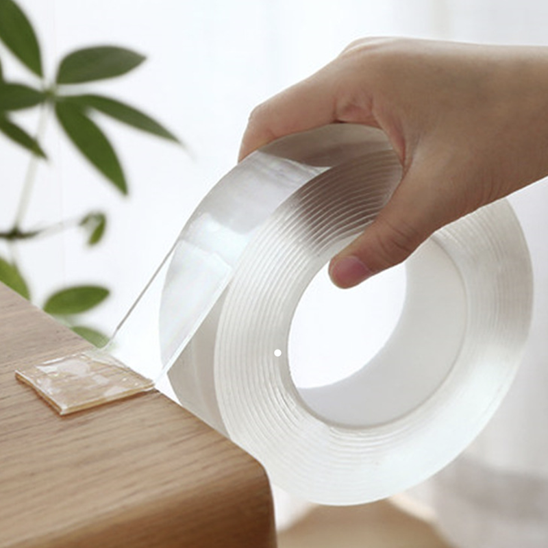 "Genomskinlig, självhäftande nanotejp rullad på spole, stark och återanvändbar, perfekt för hemmet, lätt att fästa"