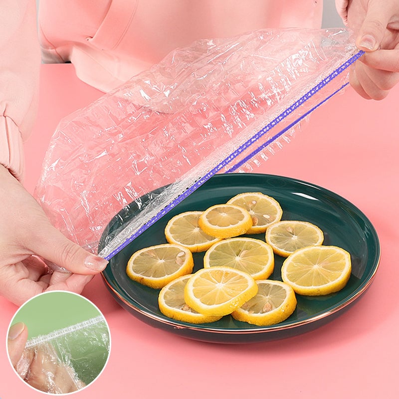 "Genomskinliga PE-plastpåsar med elastiska band för matförvaring; luktfria, giftfria och idealiska för köksanvändning."