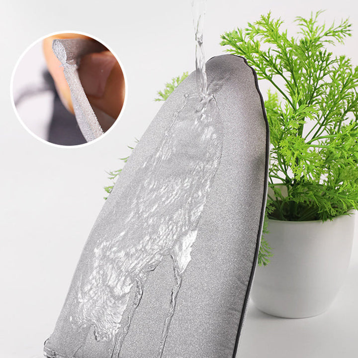 "Grå ergonomisk värmebeständig ångbåtshandske för alla handstorlekar, erbjuder säker hantering av varma kläder."