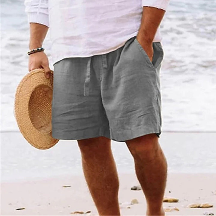 "Gula herrshorts i linneblandning med elastisk midja och fickor, idealiska för sommarens avslappnade stil."