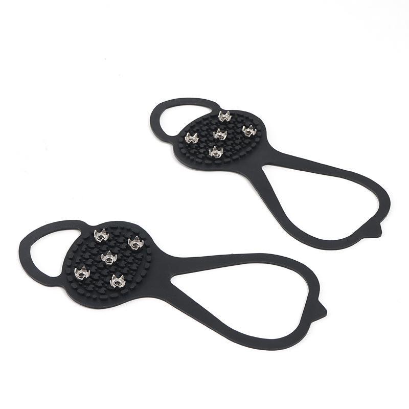 "Halkfria silikon skoskydd, unisex, svart, robusta stålpinnar för isigt underlag, designade för säker vintergång."