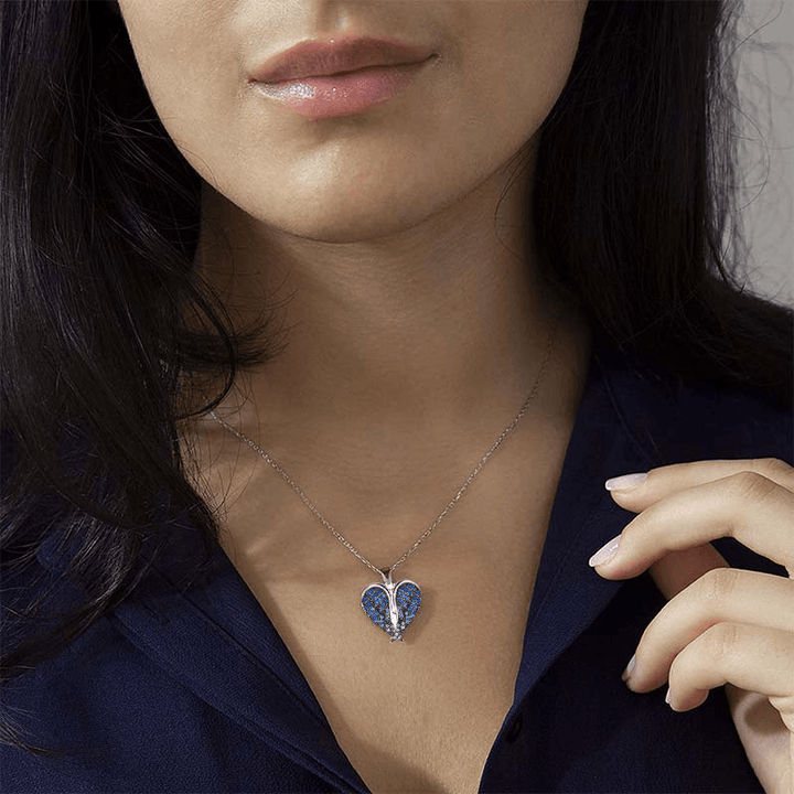 "Hängande halsband med hjärta och änglavingar, silverglänsande, smycket för damer, symbol för skydd och hopp."