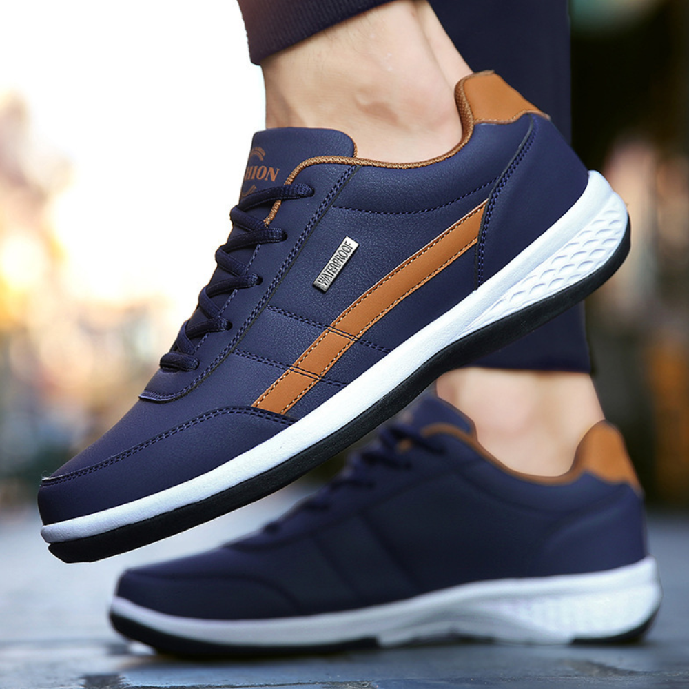 "Herr sneakers med lättvikt och snörning, framifrån, syntetiskt läder och textil, stötdämpande, sportig stil."