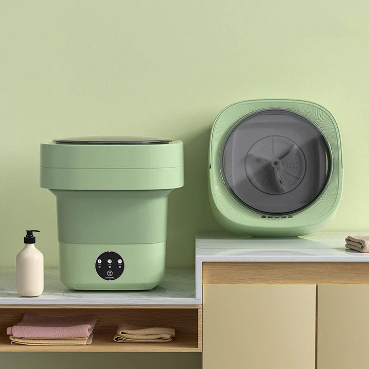 "Hopfällbar portabel tvättmaskin med kompakt design, 6L kapacitet, vit och blå detaljer för effektiv tvätt."